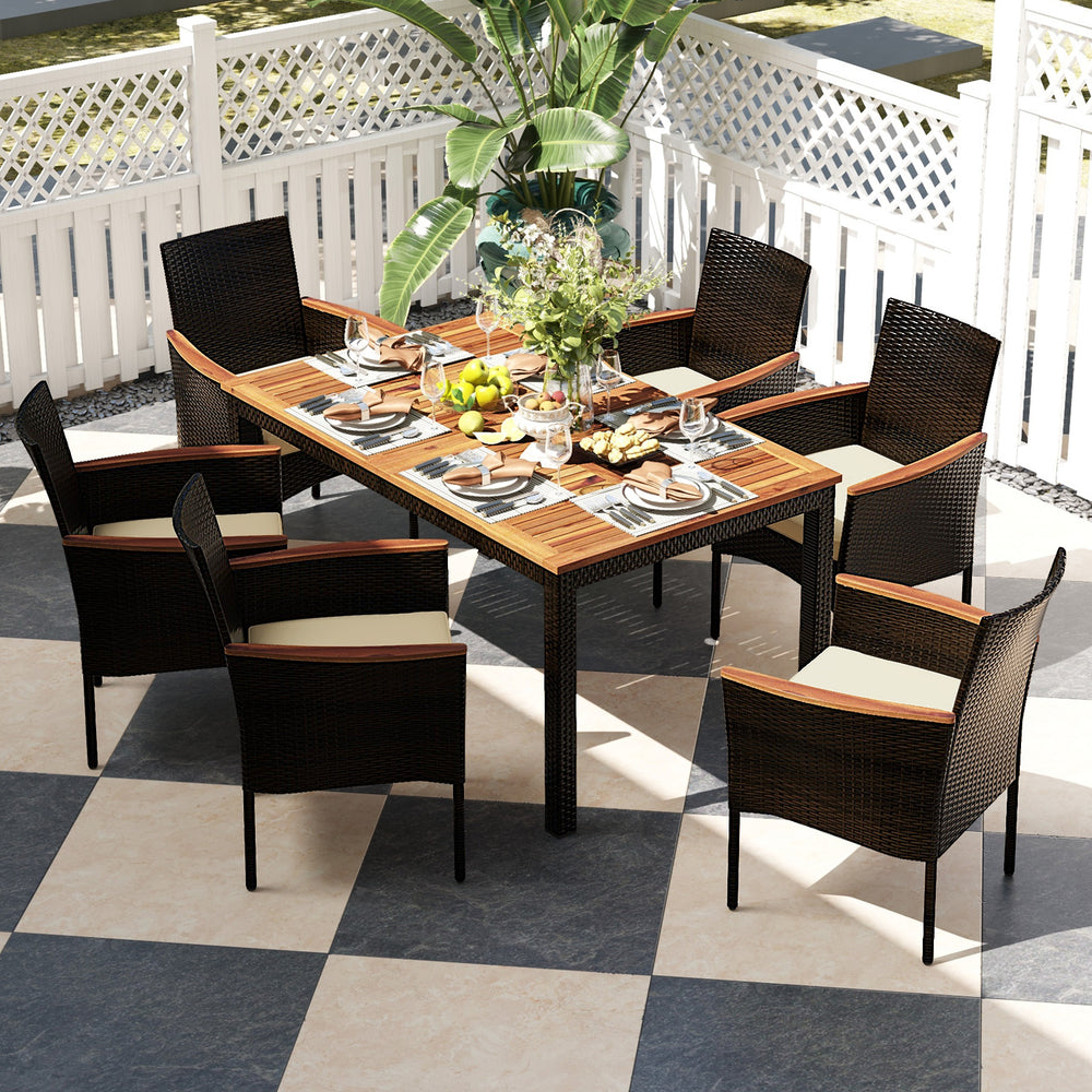 This stylish and functional set includes 6 stackable chairs with armrests  as well as a spacious wooden tabletop dining table. The durable rattan construction is weather-resistant and perfect for outdoor use  while the 1.96'' umbrella hole in the table al