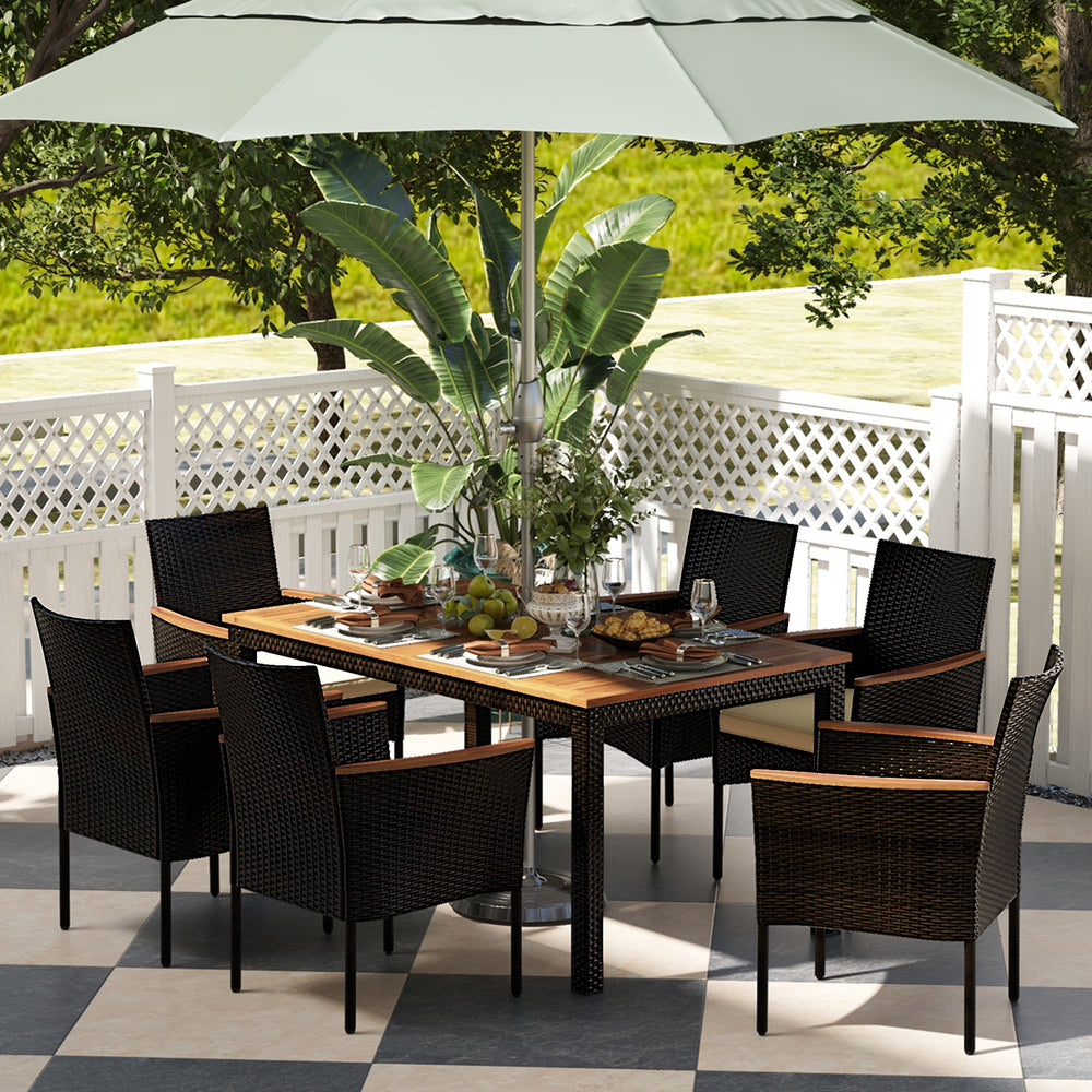 This stylish and functional set includes 6 stackable chairs with armrests  as well as a spacious wooden tabletop dining table. The durable rattan construction is weather-resistant and perfect for outdoor use  while the 1.96'' umbrella hole in the table al