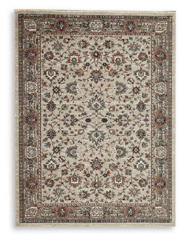 The muted tones and floral pattern of this rug lends classic character to your living space. Its traditional feel is made more modern with shades of blue, brown, rust and cream. Timelessly designed, it helps you to craft your ideal aesthetic from the grou