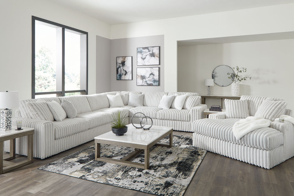 Donâ€™t want to sacrifice standout style for majorly cozy seating? This set pairs bold character with sink-in comfort. Its retro-cool jumbo cord over feather-blend cushions creates a luxuriously soft lounging experience. With this sectional and chaise, yo