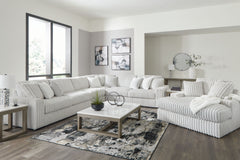 Donâ€™t want to sacrifice standout style for majorly cozy seating? This set pairs bold character with sink-in comfort. Its retro-cool jumbo cord over feather-blend cushions creates a luxuriously soft lounging experience. With this sectional and chaise, yo