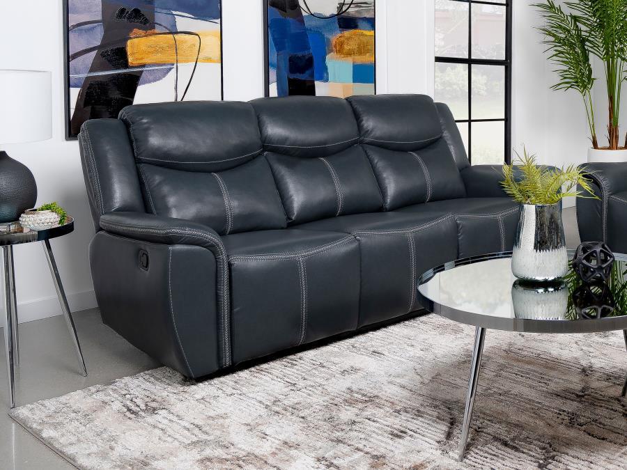 Whisk away to a world of comfort with this plush three-seater reclining sofa, where convenience meets modern luxury. The central armrest unfolds to reveal a sleek drop-down console, complete with gleaming stainless steel cup holders and a hidden pop-up po
