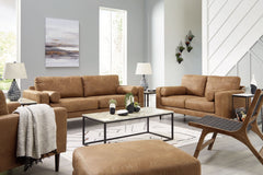 Small-scale style, tailored to perfection. This seating package echoes retro aesthetics with warm caramel faux leather, while its ultra-linear silhouettes incorporate a contemporary edge. Versatile in form and function, this set suits styles from modern b