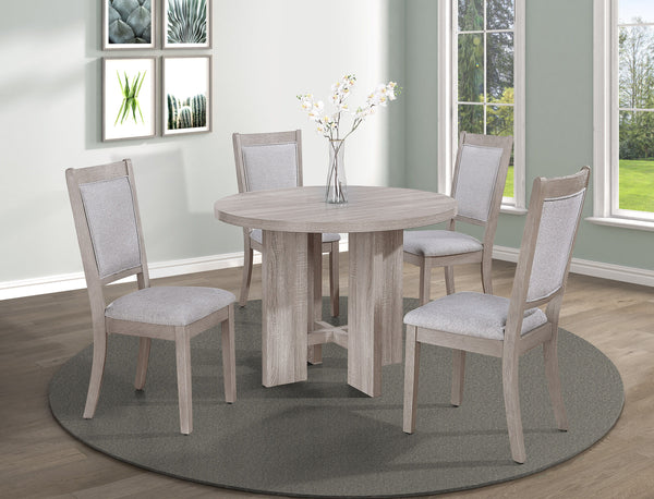 This charming dining set exudes a coastal-inspired aesthetic, perfect for creating a light and airy dining atmosphere. The set centers around a round table with a weathered wood finish, offering a casual yet refined dining surface that invokes a sense of 