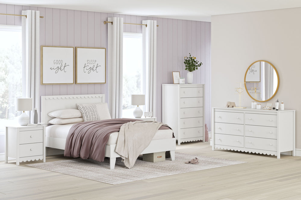 Thanks to its playful scallop design, this bedroom package is the perfect fit for cottage or coastal farmhouse interiors. Its matte white finish serves as the perfect backdrop to showcase your personal taste and creativity. Plus the low-profile bed frame 