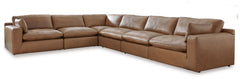 Catering to your contemporary lifestyle, this sectional is a handsome marriage of masculine and feminine sensibilities. Feather-fiber cushions and bolster pillows soften the look of its chunky, linear silhouette. A warmly hued combination of leather and f