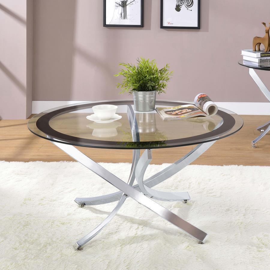 Infuse your living space with the warmth of a contemporary coffee table, designed to harmoniously blend modernity and comfort. The artfully curved, crisscrossing metal base is electroplated for a lustrous finish, supporting a clear tempered glass top enci