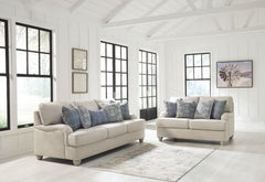 Everyone can have the best seat in the house with this sofa and loveseat. An indulgent choice with deep seats crafted for cloud-like softness, this set is the ideal merger of modern flair and classic staying power. <h4><b>Traemore - Linen - Sofa</b></h4> 