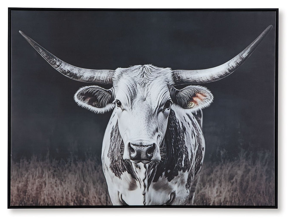 Add homespun charm to modern farmhouse and casual spaces. A longhorn cow takes center stage in this wall art, its white coat contrasting beautifully against the dark background tones. A sleek black frame completes the look.<br/><br/><b>Product Features</b