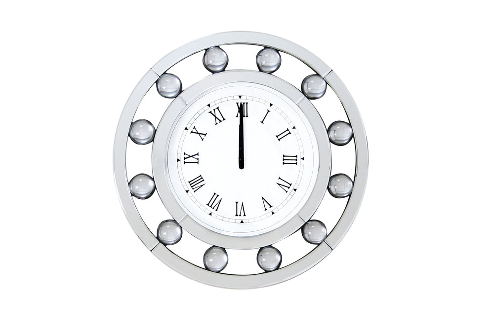 Time to shine with the Boffa mirrored wall clock. This clock features a circular floating crystal balls and beveled mirror frame. The clock face has a clean, modern look featuring roman numerals. Its casual yet elegant look will become the most stunning d
