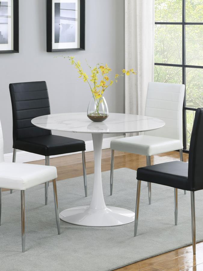 Add a modern twist to your dining space with this round dining table featuring a sleek pedestal base and an easy-to-clean white faux marble top. Designed for smaller spaces, this stylish table seats up to four comfortably while bringing a fresh, retro vib