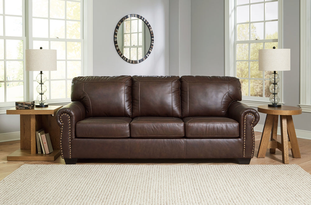 Sporting traditional elements including a roll arm frame with nailhead trim, this set provides here-and-now relevance. Mix in this combination of comfort and affordable luxury for a look youâ€™ll love for years to come. <h4><b>Colleton - Dark Brown - Sofa