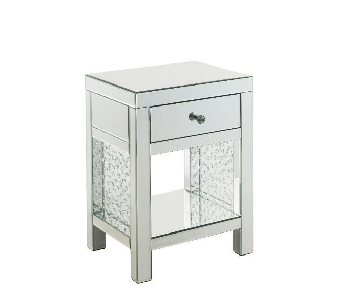 The Nysa Accent Table will give any room a touch of glamour. Mirrored finish and glass surfaces give it a modern and clear touch while faux crystals inlays add glam style to this piece. Use this unique piece as the perfect accent for any room dÃ©cor. It h