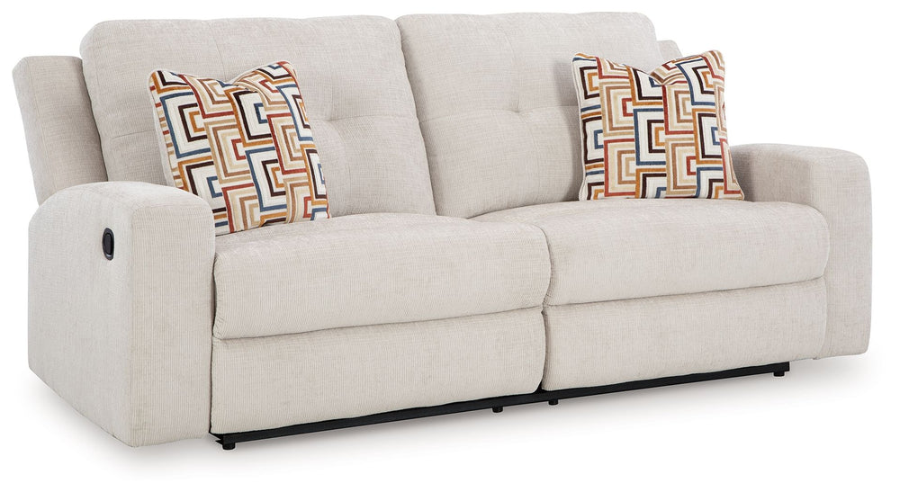 This reclining sofa invites you to a luxuriously soft lounging experience. The chic hue fits right in with contemporary color palettes. A tufted back keeps the look right on trend. Balancing style and function, its pull tab reclining effortlessly takes yo
