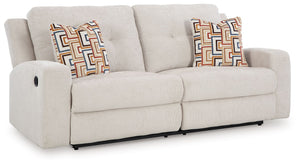This reclining sofa invites you to a luxuriously soft lounging experience. The chic hue fits right in with contemporary color palettes. A tufted back keeps the look right on trend. Balancing style and function, its pull tab reclining effortlessly takes yo