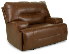 Master statement-making contemporary comfort with this power recliner. It displays a striking yet streamlined profile, with expertly matched leather and faux leather upholstery in an auburn hue balancing natural beauty and refined design. An adjustable he