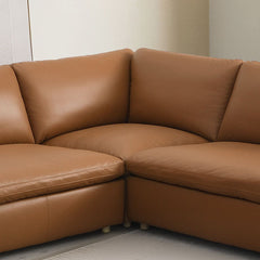 The Brighton sectional sofa exudes contemporary elegance and comfort. Covered in brown top grain leather, this spacious sectional is perfect for family gatherings or cozy evenings at home. Its sleek design and plush cushions offer both style and relaxatio