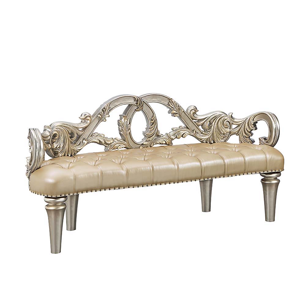 Feast your eyes upon the decadence and true luxury of the Danae collection of furniture! This striking bed defines opulence! Created to make a statement, this regal bed invites you to hold court in its divine carved curves and details. The Champagne finis