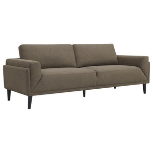 Unveiling our modern sofa, where innovation meets elegance in a frame within a frame design. Adorned in a chic fabric, its streamlined silhouette is highlighted by meticulous topstitch details and track arms complemented by mitered front accents. Prioriti