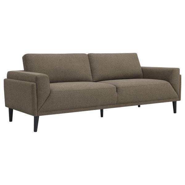 Unveiling our modern sofa, where innovation meets elegance in a frame within a frame design. Adorned in a chic fabric, its streamlined silhouette is highlighted by meticulous topstitch details and track arms complemented by mitered front accents. Prioriti