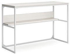 Bring your vision of a modern home workspace to life with this sleekly designed home office desk. Its linear construction and white finish keep things minimal. A small shelf along the back rounds out the versatile, striking desk.<br><br><b>Additional Dime