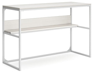 Bring your vision of a modern home workspace to life with this sleekly designed home office desk. Its linear construction and white finish keep things minimal. A small shelf along the back rounds out the versatile, striking desk.<br><br><b>Additional Dime