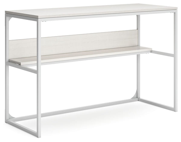 Bring your vision of a modern home workspace to life with this sleekly designed home office desk. Its linear construction and white finish keep things minimal. A small shelf along the back rounds out the versatile, striking desk.<br><br><b>Additional Dime