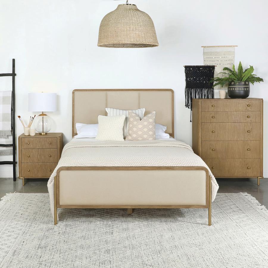 Elevate your coastal bedroom with this stunning panel bed, designed with retro-inspired elements and luxurious details. Cream fabric upholstery on the headboard and footboard is framed by a sleek black edge, creating a bold contrast and soft texture. The 