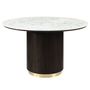  supported by a single pedestal base adorned with metal trim. Accompanied by upholstered chairs and a server with sleek metal legs