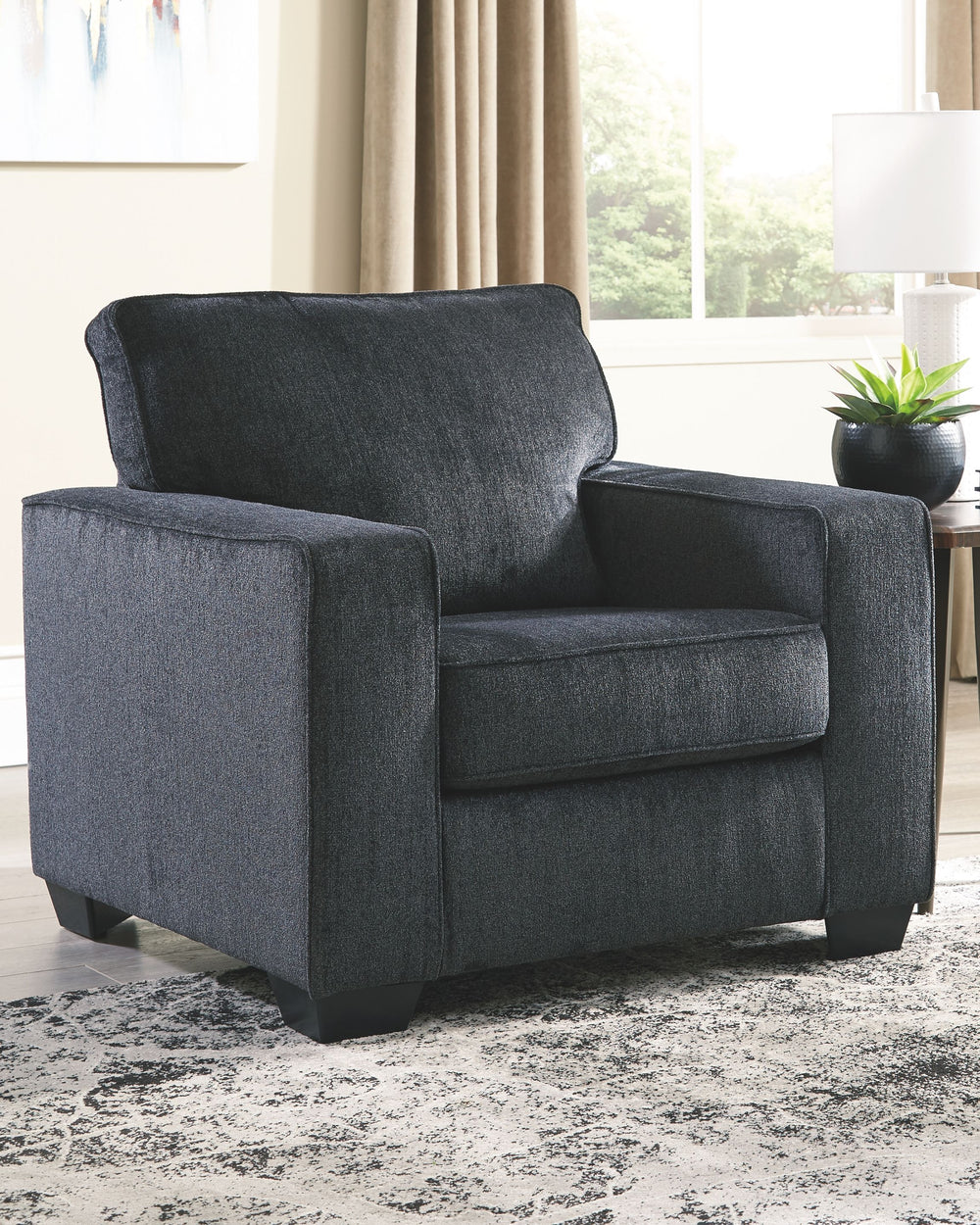 If style is the question, then this chair is the answer. Its decidedly contemporary profile is enhanced with plump cushioning and a chenille-feel upholstery that-'s so pleasing to the touch. Rest assured, this chair in slate gray is sure to play well with