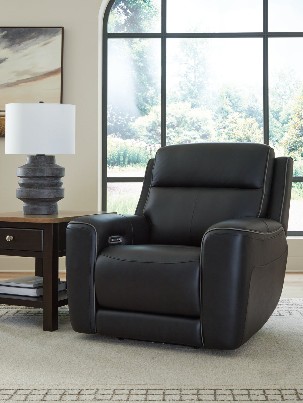 Relax like never before. This power recliner offers the look and feel of leather at a comfortably affordable faux leather price. With chic tailoring and stylish welting, it creates a sophisticated presence and makes a lasting impression. And when you-'re 