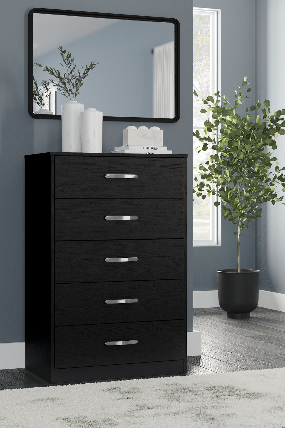 Practical and attractive, this chest of drawers blends seamlessly with modern decor and makes a smart addition to a bedroom. Five spacious drawers will keep your clothes neat and organized. Sleek metal pulls in a brushed nickel-tone finish add to the stre