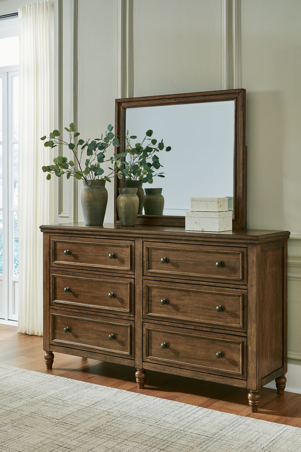 Traditional style doesnâ€™t have to be stuffy. It can feel warm, inviting and beautifully in the moment. Case in point: this dresser and mirror set. Merging a thick profiled top and simple bead moulding with a relaxed sensibility, the piece has an allure 