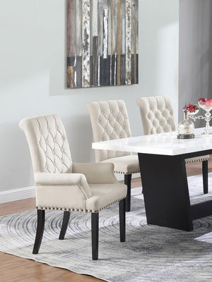  this arm chair brings an elegant presence to any dining space. Its button-tufted high back and rolled top lend a timeless aesthetic