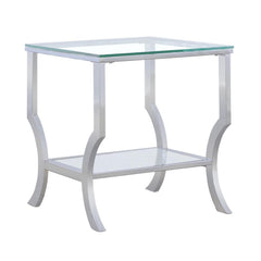 Add a modern touch to your space with this sleek rectangular end table. It features a clear tempered glass top and a matching lower shelf for storage or display. The curved legs and open design bring a light, contemporary feel, while the electroplated pol