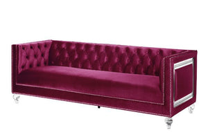 Looking to create a glamorous living room, look no further. The Heibero collection is ideal for that. Featuring timeless button tufting and the more modernized fine details such as the mirrored trim accents. The burgundy velvet upholstery is an eye-catche