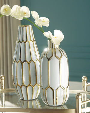  this 2-piece vase set is what your homeâ€™s been missing. Varying sizes in the honeycomb-inspired geometric pattern bring visual appeal. These vases arenâ€™t just good for looks