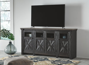  this TV stand appeals to todayâ€™s more relaxed sensibilities. Its richly rustic two-tone effect blends a textured black finish with a weathered gray-brown top for an easy-elegant aesthetic. Framed doors with 