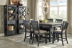Unique two-tone finish with a combination of Oak and Acacia substrates combining a trendy textured antique black color with table and server tops finished in a textural weathered oak finish. Rectangular dining table features six convenient drawers for sto