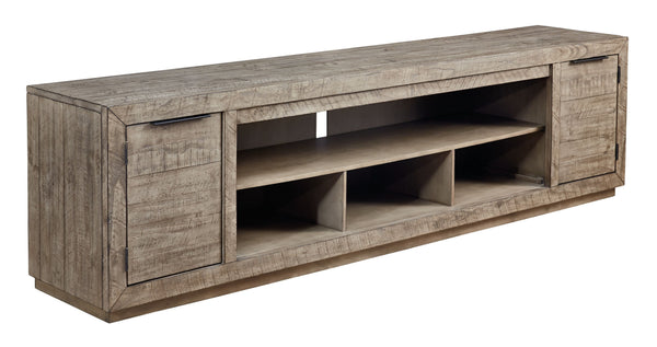 This extra-large TV stand is sure to win your heart with its daring take on modern rustic expression. Its crisp, clean minimalist-chic profile is enriched with striking pine wood grain and a weathered gray finish with distressed saw mark texture. Designed