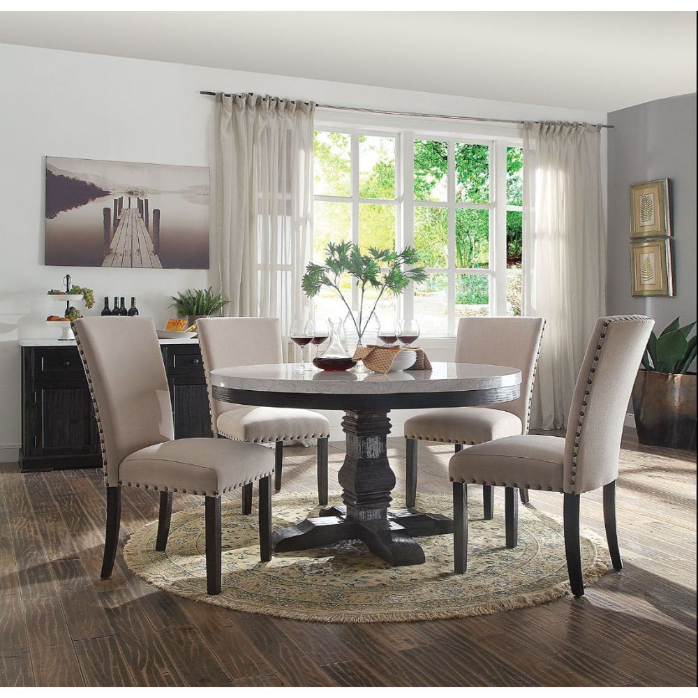 The Nolan marble dining collection offers an elegant design to turn your dining area into the most eye catching spot of your house. Each piece is supported by a strong wooden base in salvage dark oak, contrasting the flawless white marble table top and be
