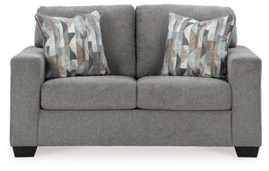  and the wide track arms are eager to support your quest for total relaxation. Distressed abstract toss pillows bring a fresh breath of contemporary 