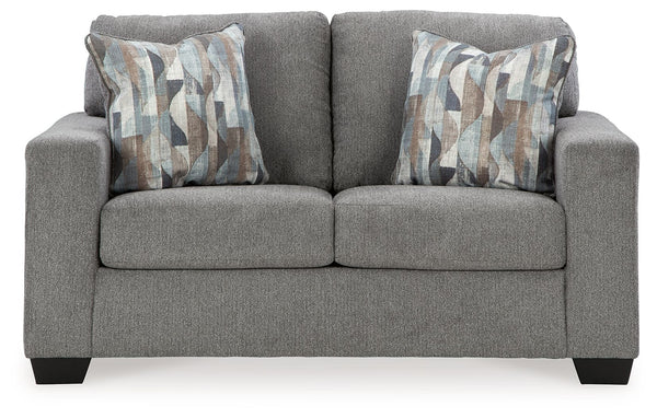  and the wide track arms are eager to support your quest for total relaxation. Distressed abstract toss pillows bring a fresh breath of contemporary 