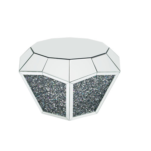 Featuring a dodecagon beveled mirrored table top that captures and reflects light from all angles. A beautiful drum base with faux diamonds that glimmer in an array of colors in the right light. Not only is this Noralie beautiful, but functional as well, 