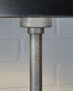  minimalistic way. The antiqued pewter-tone finish and black marble lend a richly understated touch. Whether on a ma