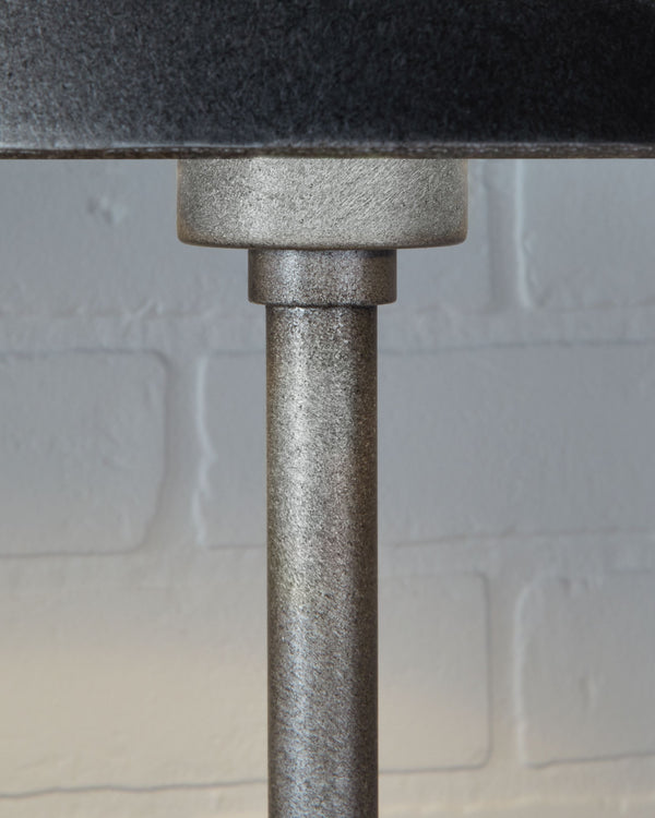  minimalistic way. The antiqued pewter-tone finish and black marble lend a richly understated touch. Whether on a ma