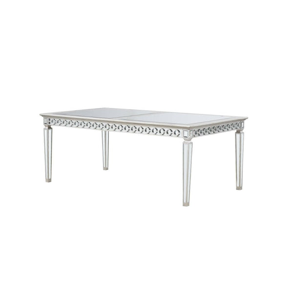 Let the Varian dining collection reflect your brilliant style! This chic set features a rectangular table accented with a beveled mirror trim in a geometric design. The matching chairs are upholstered in a lustrous blue fabric and supported by elegantly t