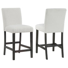 Elevate your dining experience with this chic counter height chair, a blend of simplicity and texture. Wrapped in the luxurious touch of boucle fabric, the chair offers a tactile feast, inviting guests to savor every second seated. Its silhouette stands t