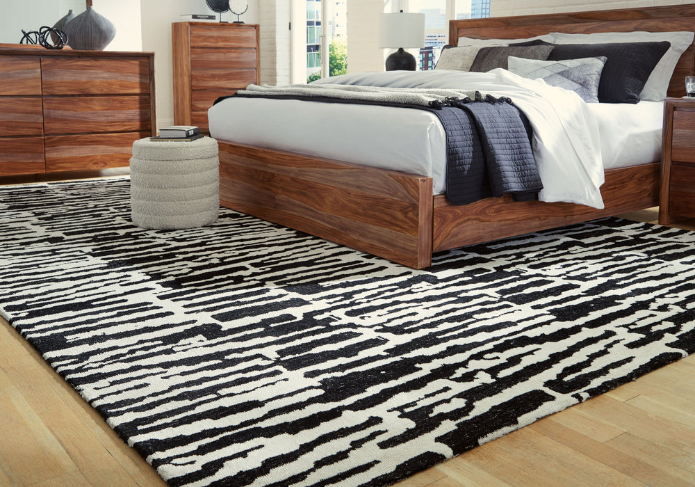 Revitalize your decor with this captivating rug. Infusing your surroundings with style, its abstract motif and rich neutral colors create the perfect pop of interest.<br/><br/><b>Product Features</b><ul><li>Made of polyester</li><li>Machine woven</li><li>