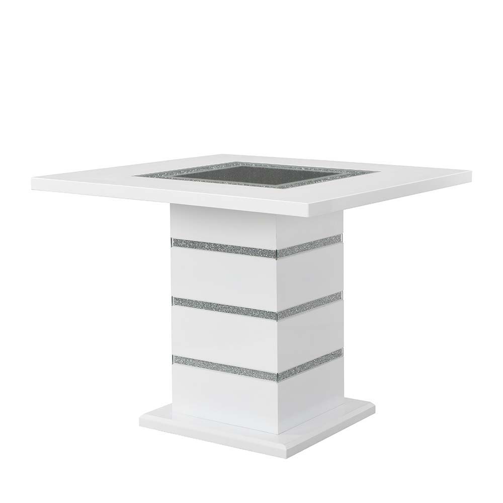 Perfect for a kitchen nook or a smaller dining space, the Elizaveta counter height dining table will fulfill all your dining needs. The white high gloss finish blends in perfectly with the glimmering faux diamond inlay base. The tabletop features silver a